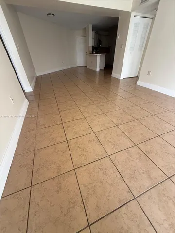 a view of a livingroom with an empty space and a sink
