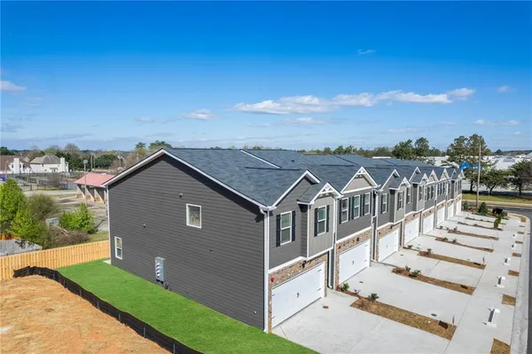 a view of a house with a yard from a balcony