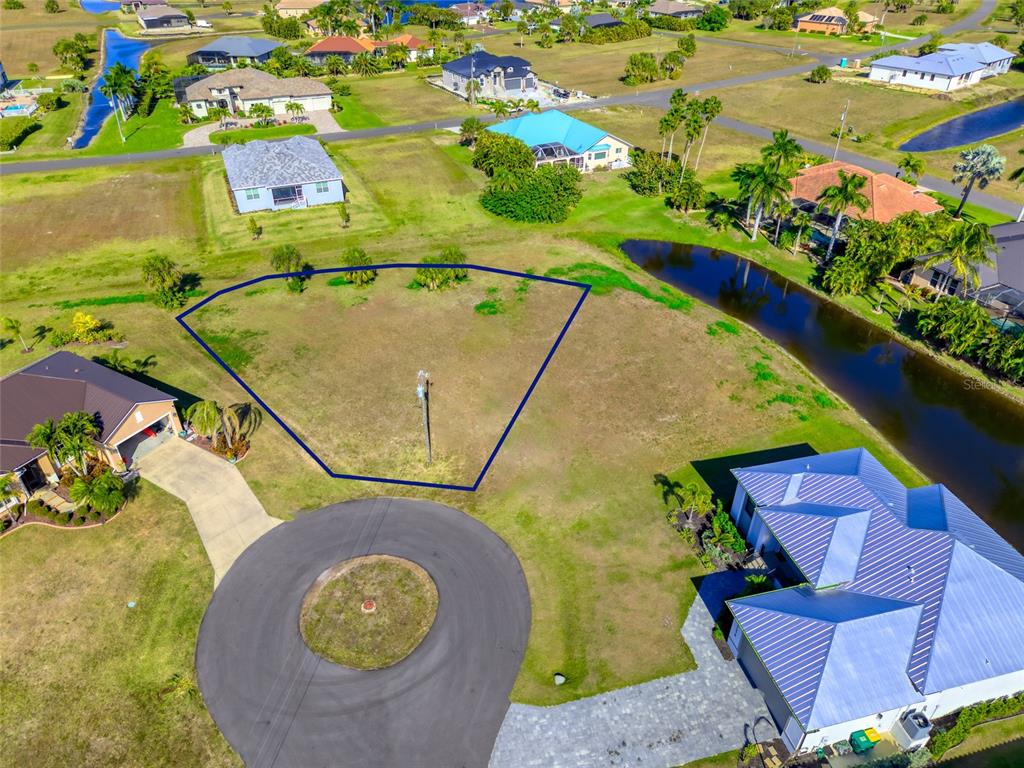17262 Comingo Lane Punta Gorda, FL 33955 - Photo 1 of 9 a view of swimming pool with a patio and garden