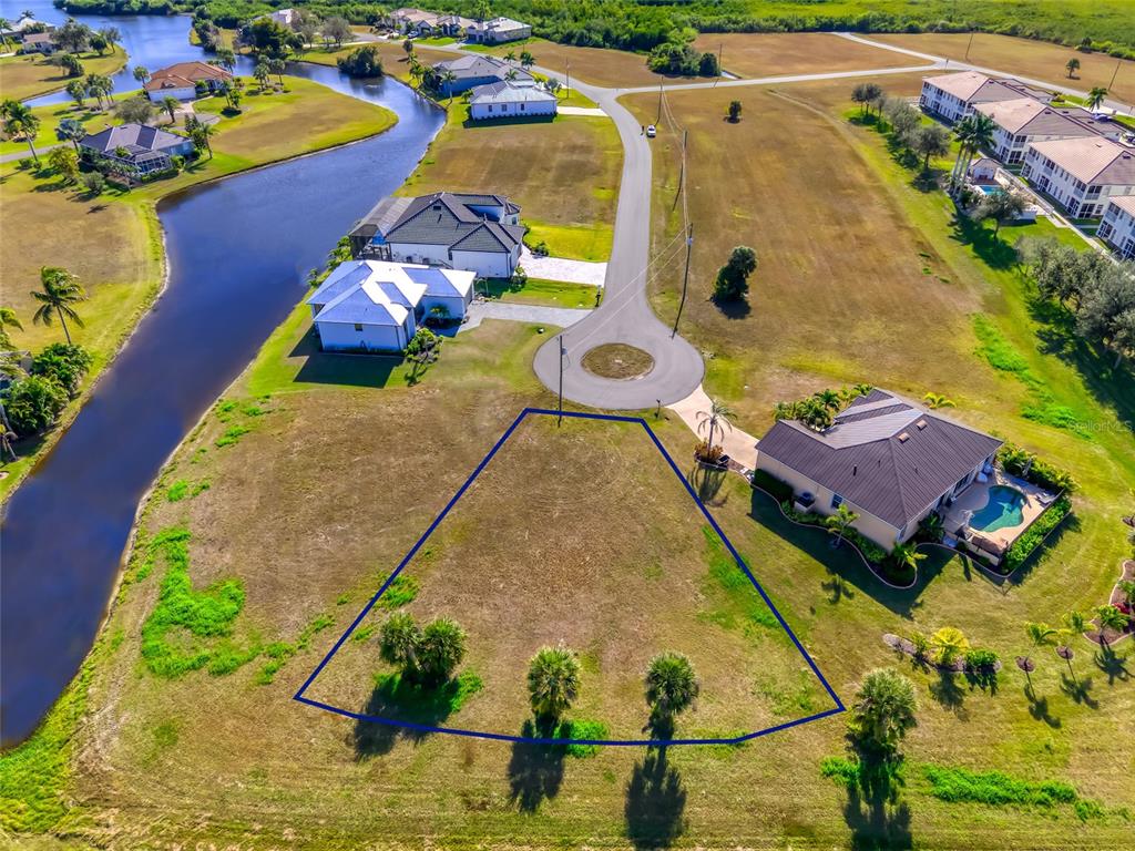 17262 Comingo Lane Punta Gorda, FL 33955 - Photo 3 of 9 an aerial view of a house with a swimming pool