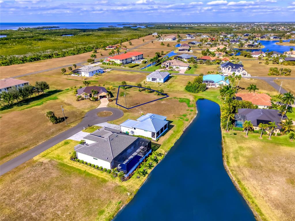 17262 Comingo Lane Punta Gorda, FL 33955 - Photo 4 of 9 an aerial view of residential houses with outdoor space