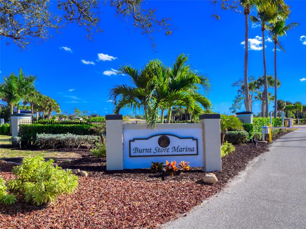 17262 Comingo Lane Punta Gorda, FL 33955 - Photo 6 of 9 a wooden fence with some potted plants