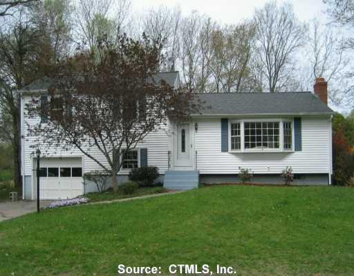 28 Old Colony Road North Stonington, CT 06359 - Photo 1 of 1 a front view of a house with a garden