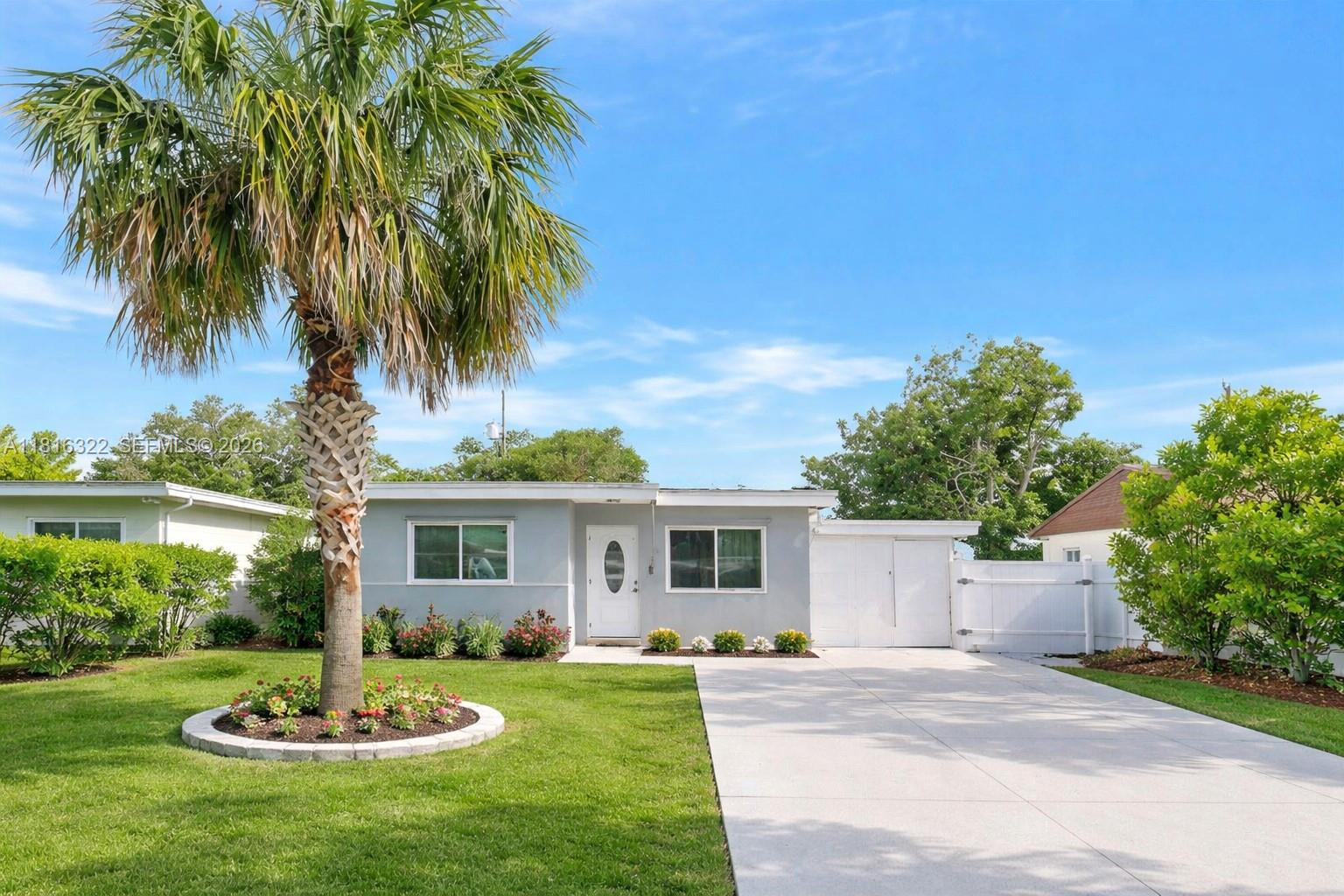 6336 Southwest 22nd Street Miramar, FL 33023 - Photo 1 of 34 Digitally enhanced staged landscaping