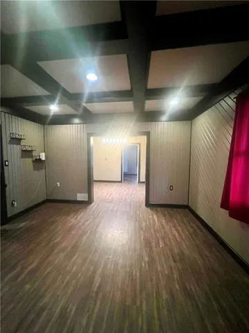 a view of a hall with wooden floor