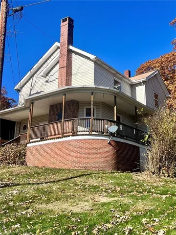 a house view with a garden space