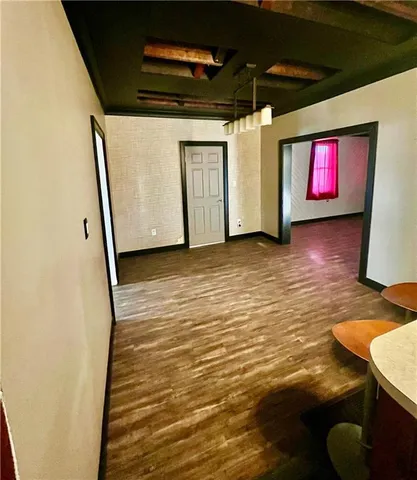a view of a livingroom with wooden floor