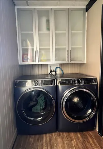 a utility room with sink dryer and washer