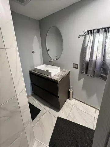 a room with furniture and a mirror