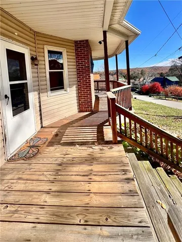 a view of a patio with a table and chairs