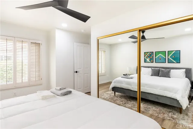 a bedroom with a large bed and a window