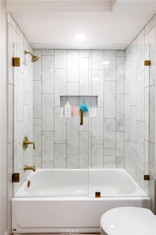 a bathroom with a bathtub and a shower
