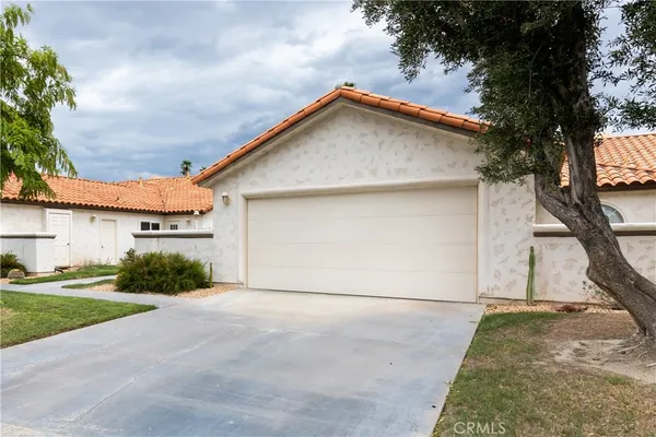 a view of garage and yard