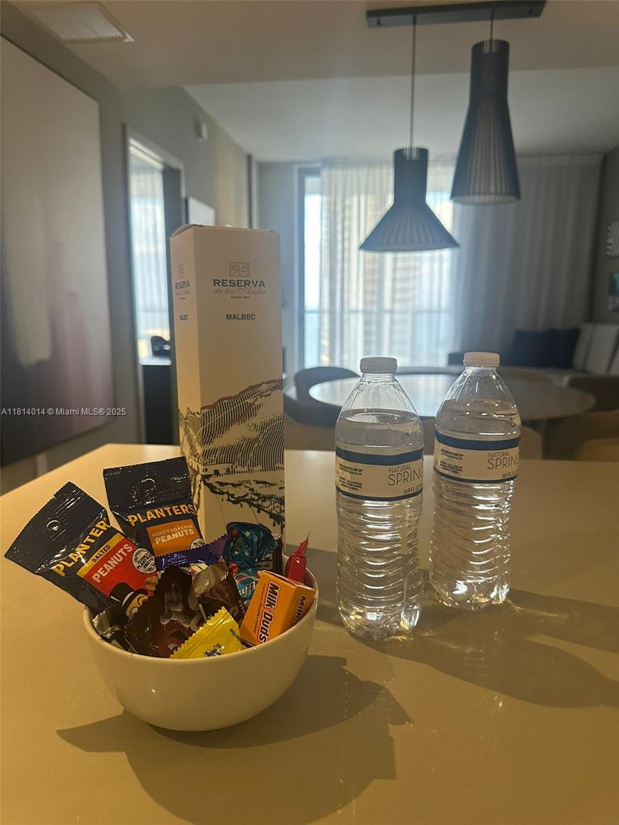 4010 South Ocean Drive, Unit R1707 Hollywood, FL 33019 - Photo 11 of 14 a room with a table and chairs