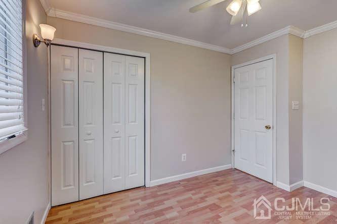 32 Ashley Road Edison, NJ 08817 - Photo 22 of 41 a view of an empty room with a chandelier