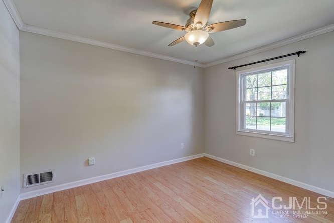 32 Ashley Road Edison, NJ 08817 - Photo 23 of 41 wooden floor in an empty room with a window
