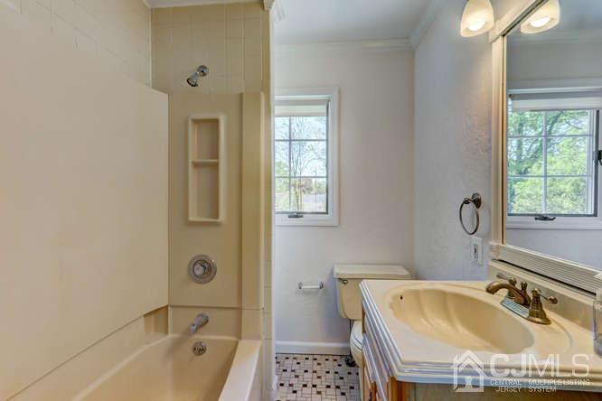 32 Ashley Road Edison, NJ 08817 - Photo 35 of 41 a bathroom with a tub a sink and a window