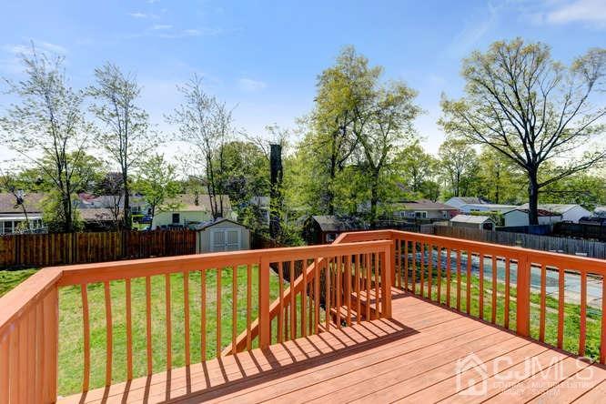 32 Ashley Road Edison, NJ 08817 - Photo 38 of 41 a view of balcony with wooden floor and fence