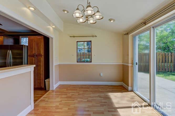 32 Ashley Road Edison, NJ 08817 - Photo 6 of 41 a view of an empty room with a window and a ceiling fan