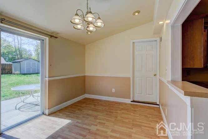 32 Ashley Road Edison, NJ 08817 - Photo 7 of 41 a view of a big room with wooden floor and windows