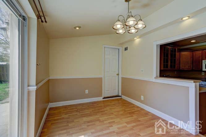 32 Ashley Road Edison, NJ 08817 - Photo 8 of 41 a view of a livingroom with a chandelier