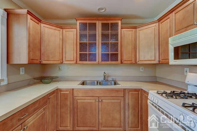 32 Ashley Road Edison, NJ 08817 - Photo 9 of 41 a kitchen with stainless steel appliances granite countertop a sink a stove and cabinets