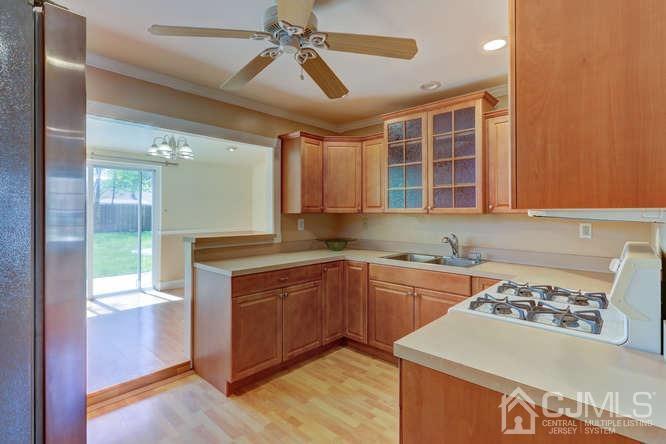 32 Ashley Road Edison, NJ 08817 - Photo 10 of 41 a kitchen with a sink stove and cabinets