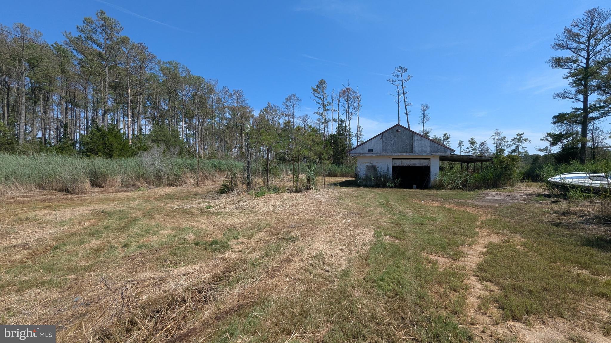 3012 William Maddox Road Crisfield, MD 21817 - Photo 2 of 20 a front view of a house with a yard