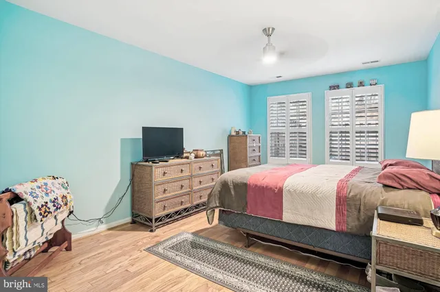 a bedroom with a bed and a television