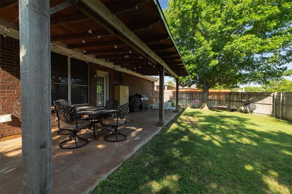 4025 Chisos Rim Trail Fort Worth, TX 76244 - Photo 35 of 40 Covered patio featuring a concrete slab and wood ceiling