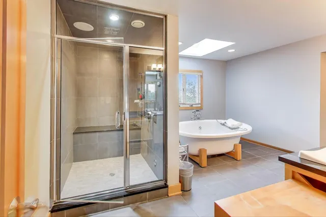 a bathroom with a sink mirror toilet and shower