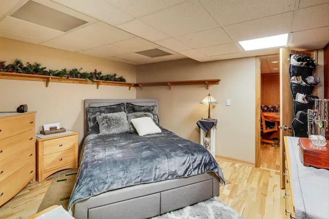 a bathroom with a granite countertop toilet a sink and a mirror