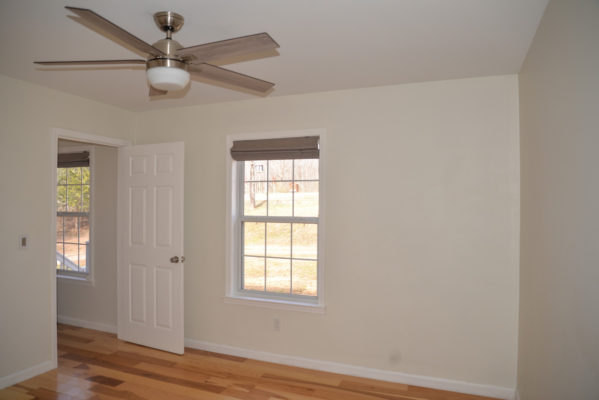 1429 Dividing Ridge Road Goodlettsville, TN 37072 - Photo 20 of 30 an empty room with wooden floor fan and windows