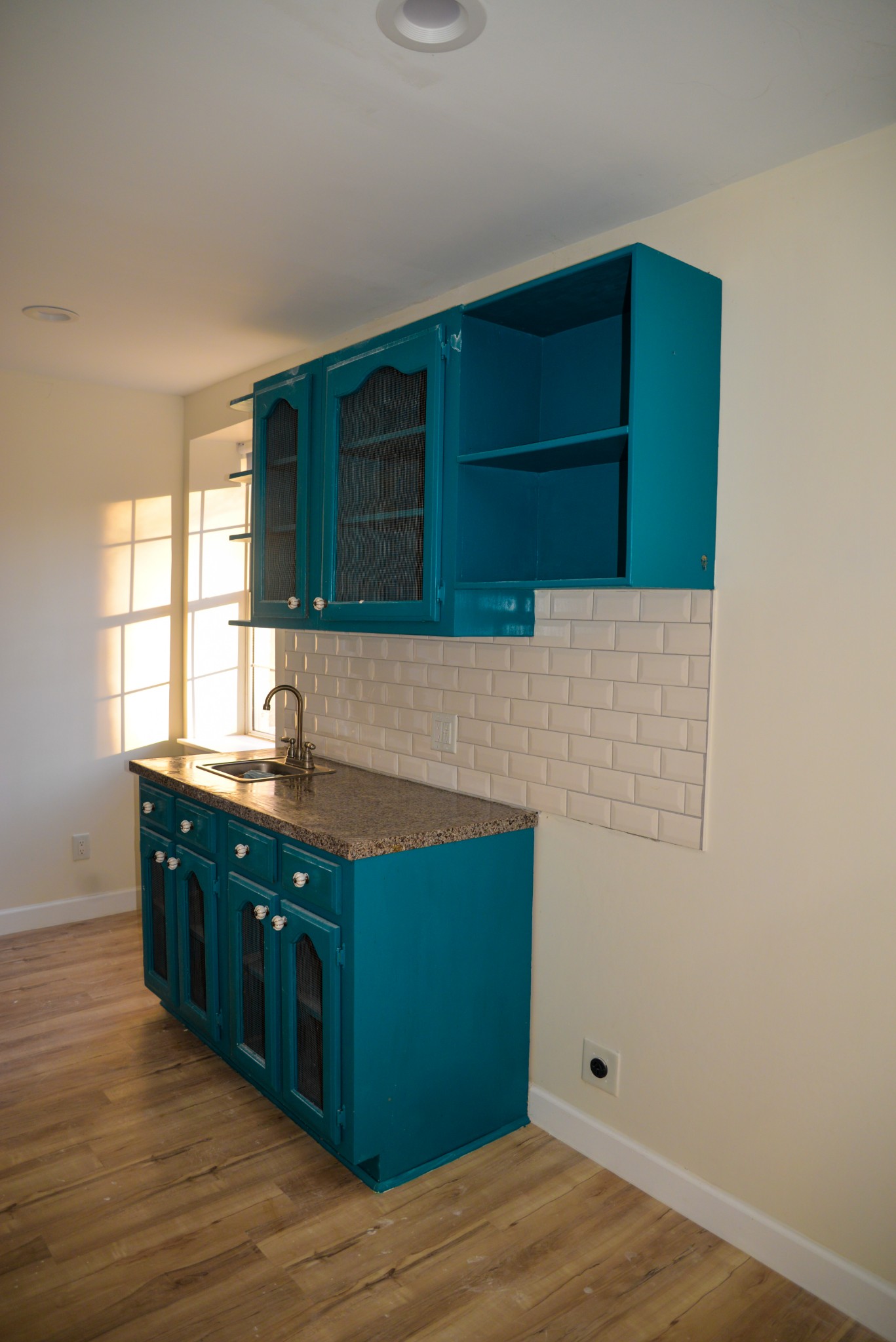 1429 Dividing Ridge Road Goodlettsville, TN 37072 - Photo 27 of 30 a kitchen with cabinets and wooden floor