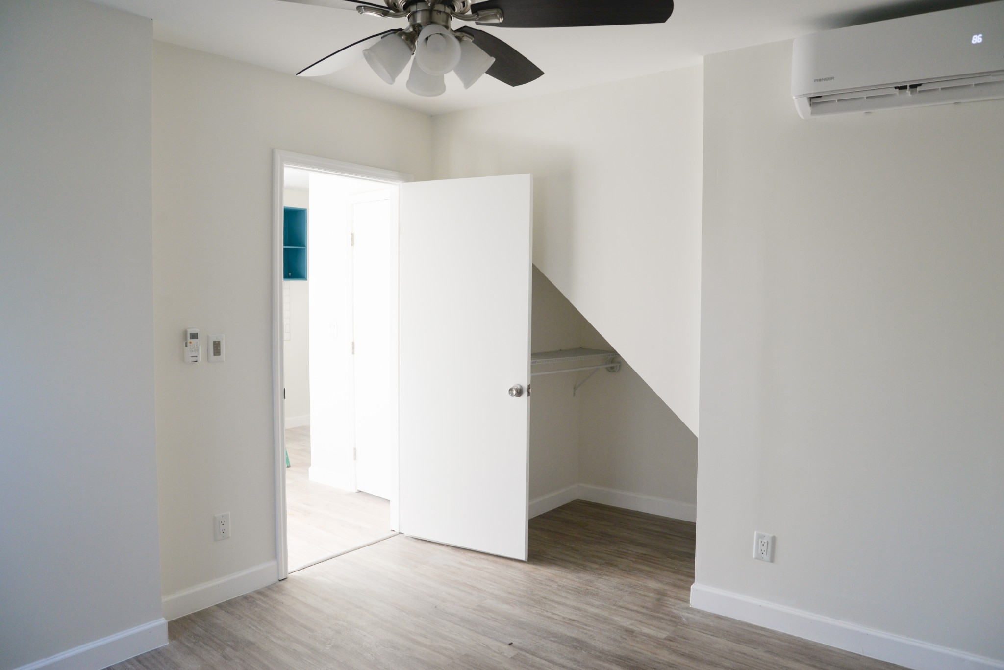 1429 Dividing Ridge Road Goodlettsville, TN 37072 - Photo 29 of 30 a view of an empty room with a chandelier fan and wooden floor