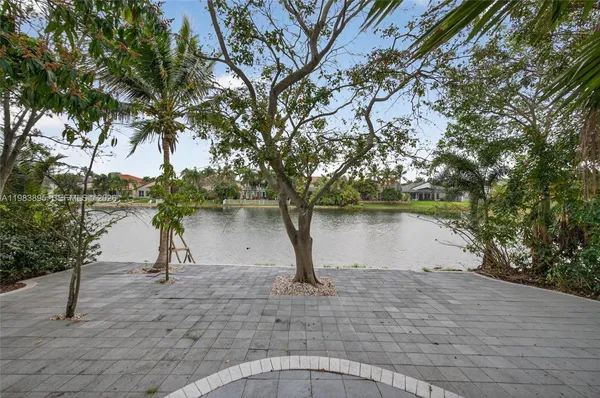 a view of a swimming pool and trees in the background