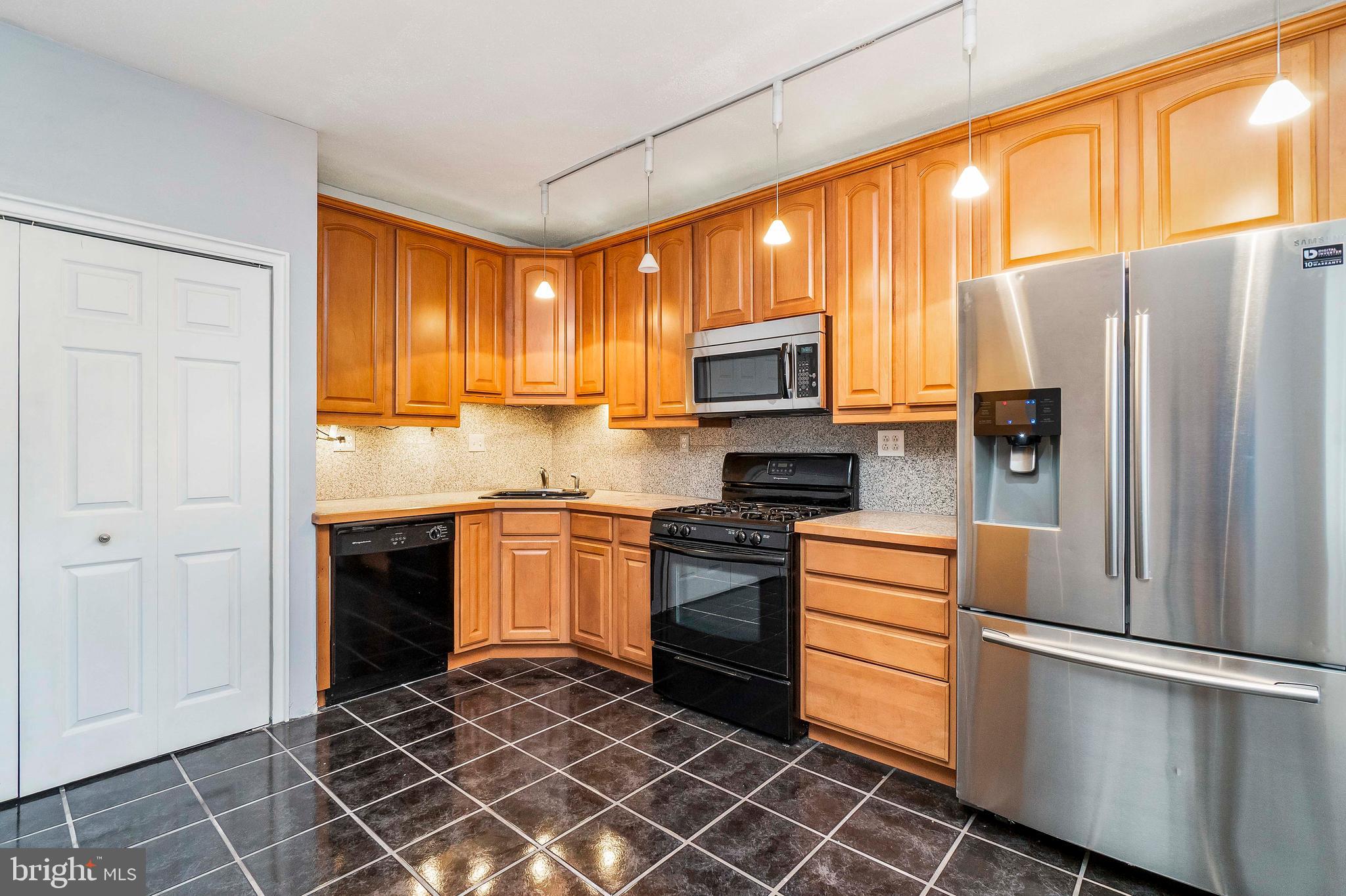 221 Ridgemede Road, Unit 204 Baltimore, MD 21210 - Photo 8 of 18 Beautiful Cabinets Throughout the Kitchen