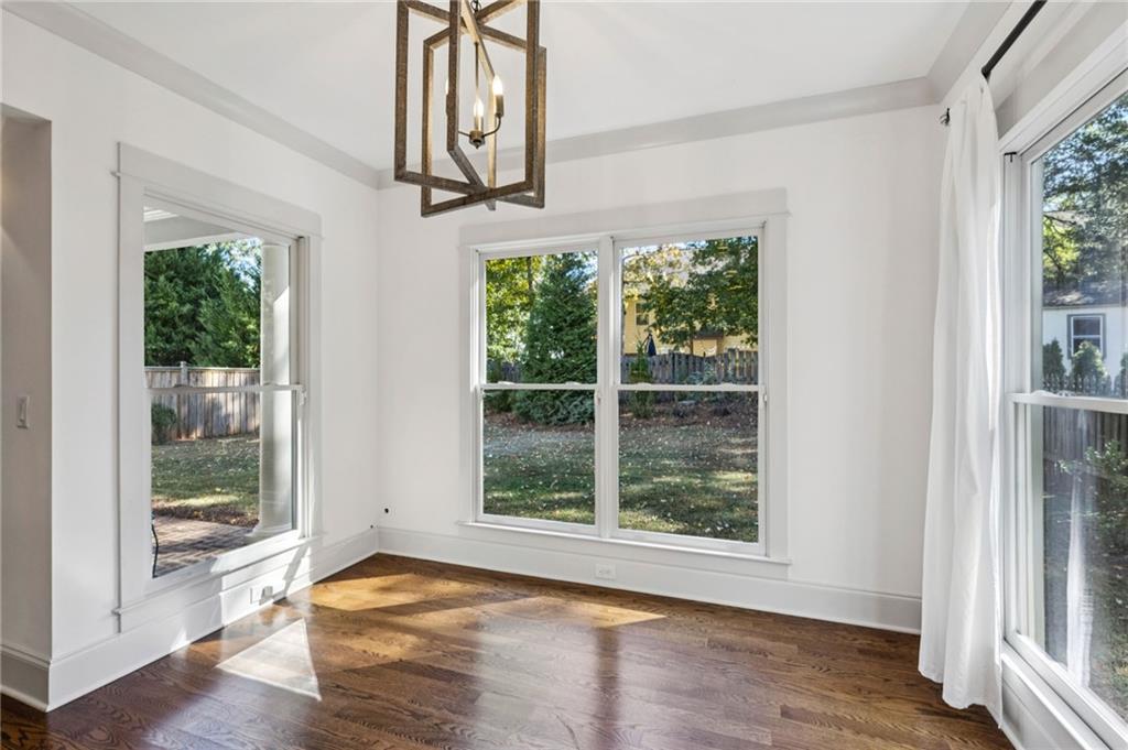 213 Ohm Avenue Avondale Estates, GA 30002 - Photo 18 of 43 a view of an empty room with wooden floor and fan
