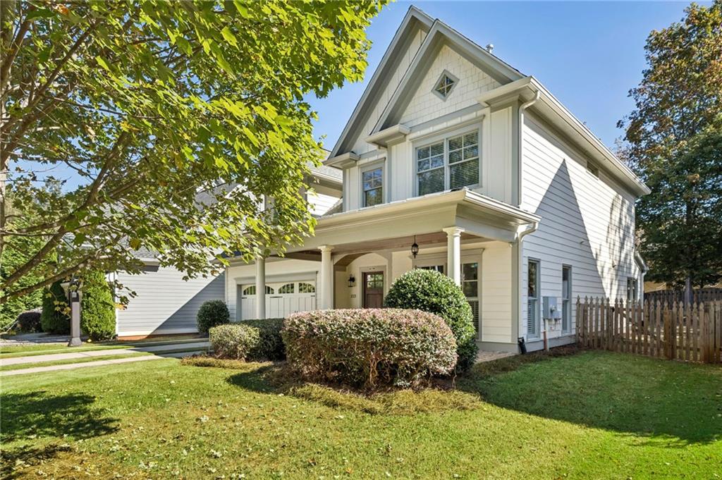 213 Ohm Avenue Avondale Estates, GA 30002 - Photo 2 of 43 a front view of a house with a yard