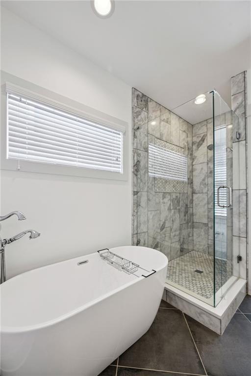 213 Ohm Avenue Avondale Estates, GA 30002 - Photo 21 of 43 a bathroom with a bathtub and a shower