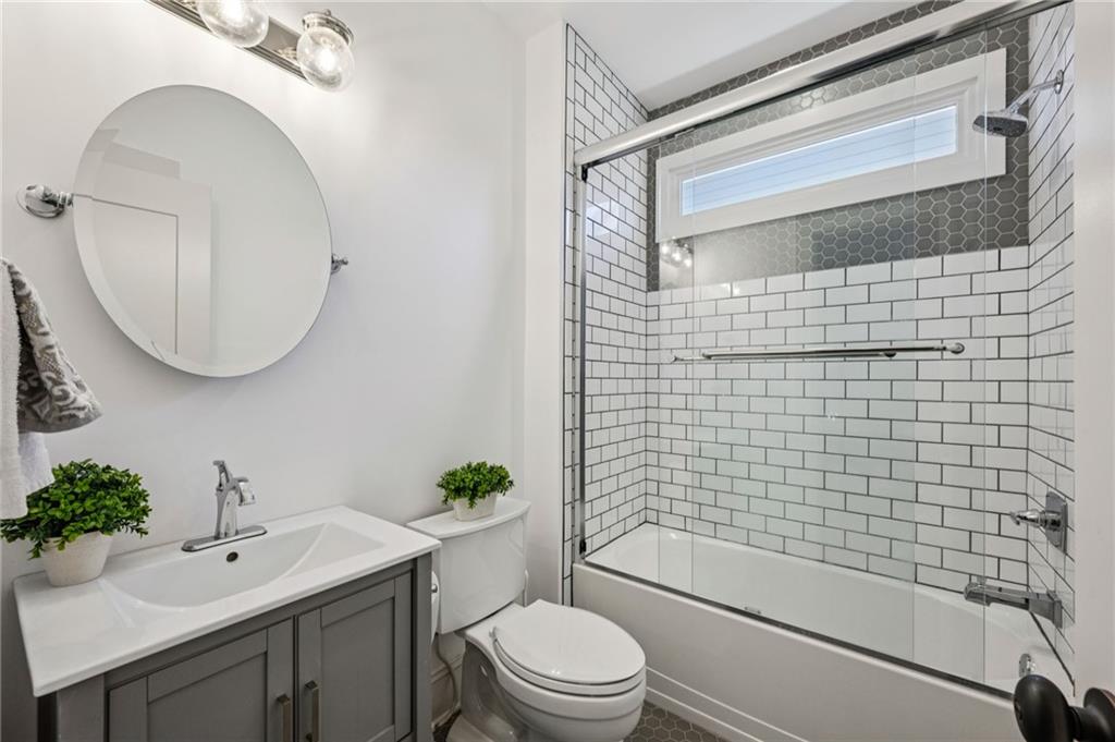 213 Ohm Avenue Avondale Estates, GA 30002 - Photo 24 of 43 a bathroom with a sink a toilet and shower