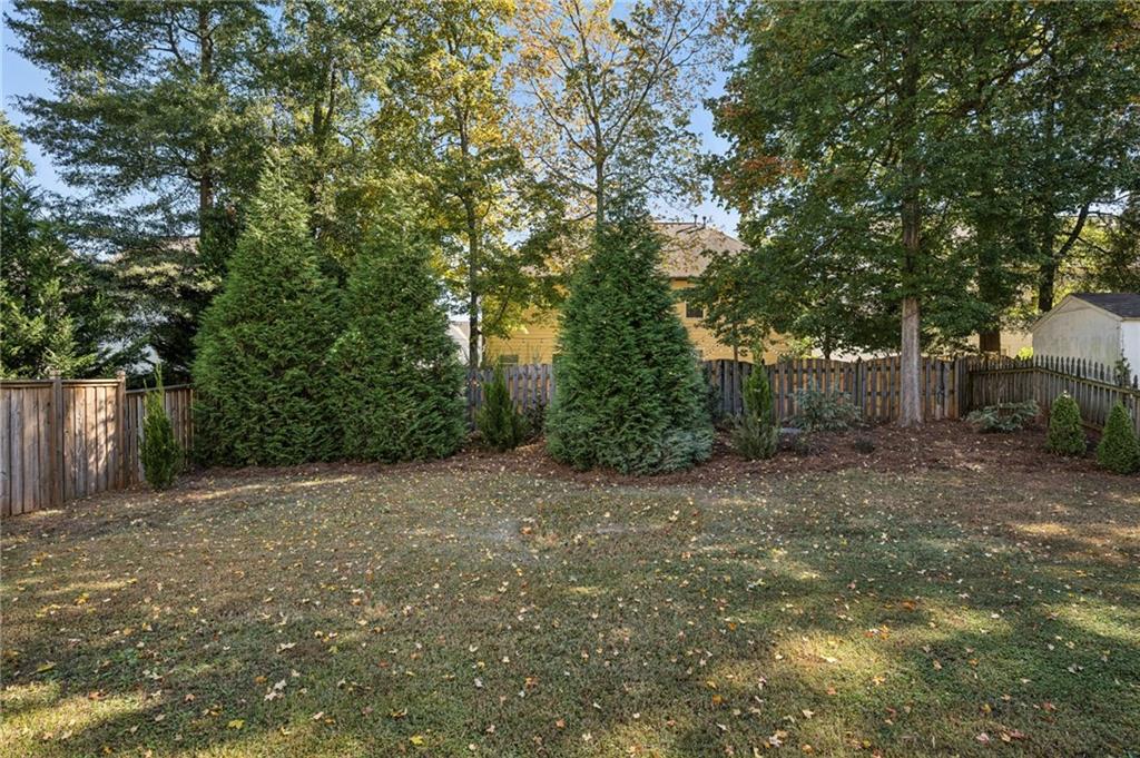 213 Ohm Avenue Avondale Estates, GA 30002 - Photo 28 of 43 a view of a backyard with large trees