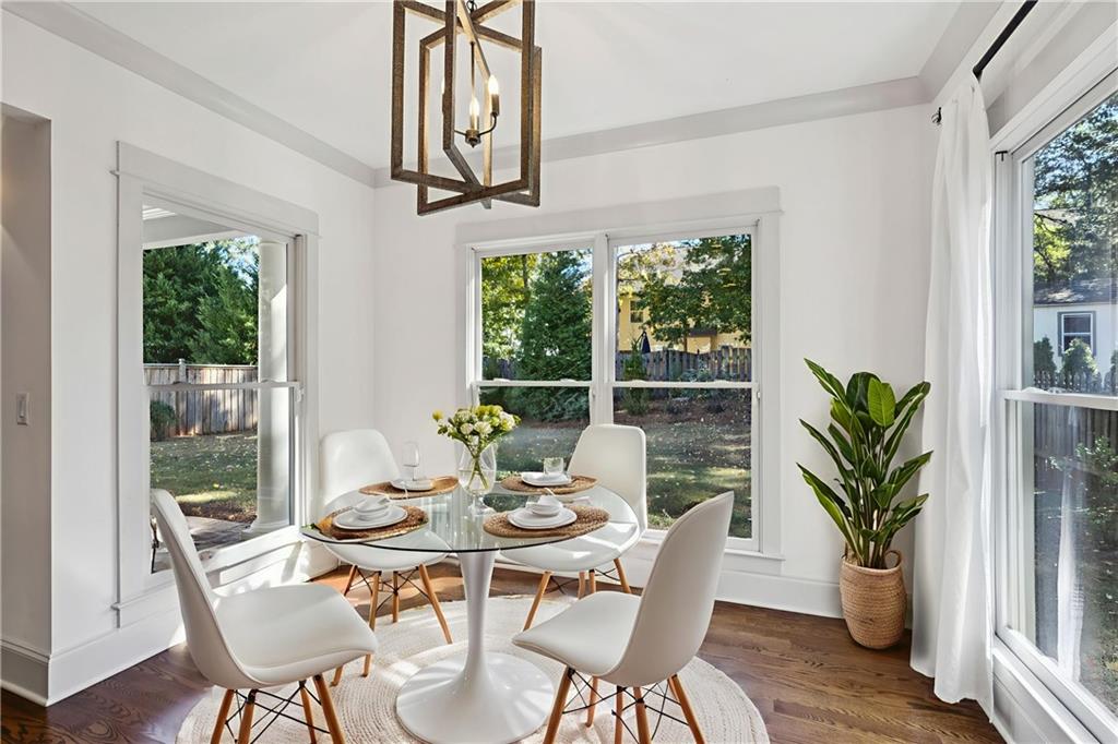 213 Ohm Avenue Avondale Estates, GA 30002 - Photo 34 of 43 a dining room with furniture window and wooden floor