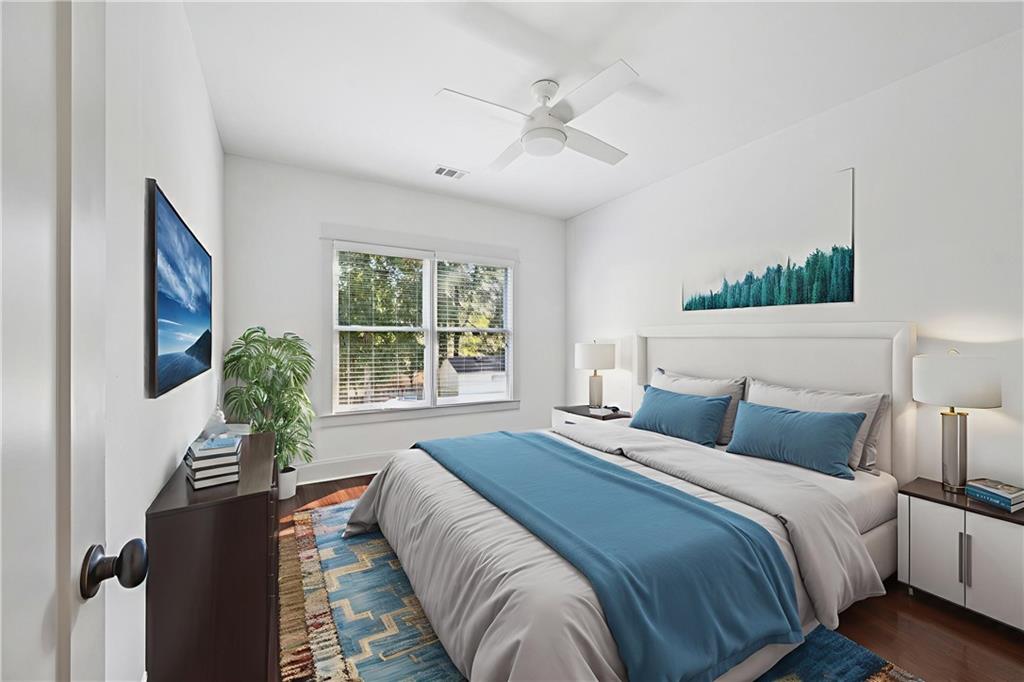 213 Ohm Avenue Avondale Estates, GA 30002 - Photo 37 of 43 a bedroom with bed and a large window