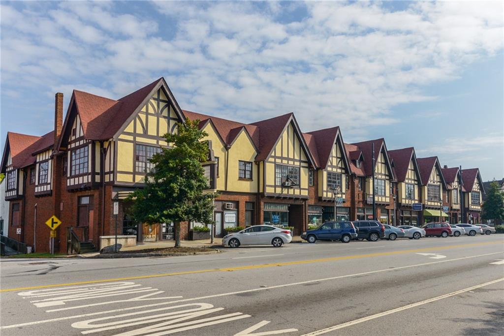 213 Ohm Avenue Avondale Estates, GA 30002 - Photo 39 of 43 a view of a big building next to a road