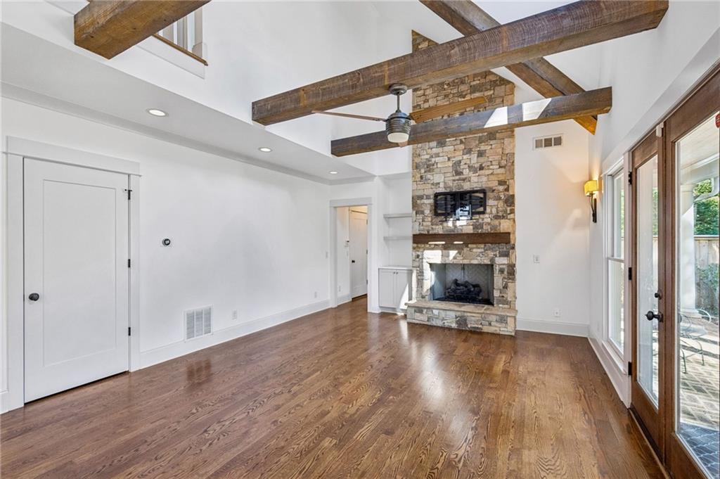 213 Ohm Avenue Avondale Estates, GA 30002 - Photo 9 of 43 a view of a big room with wooden floor a fire place