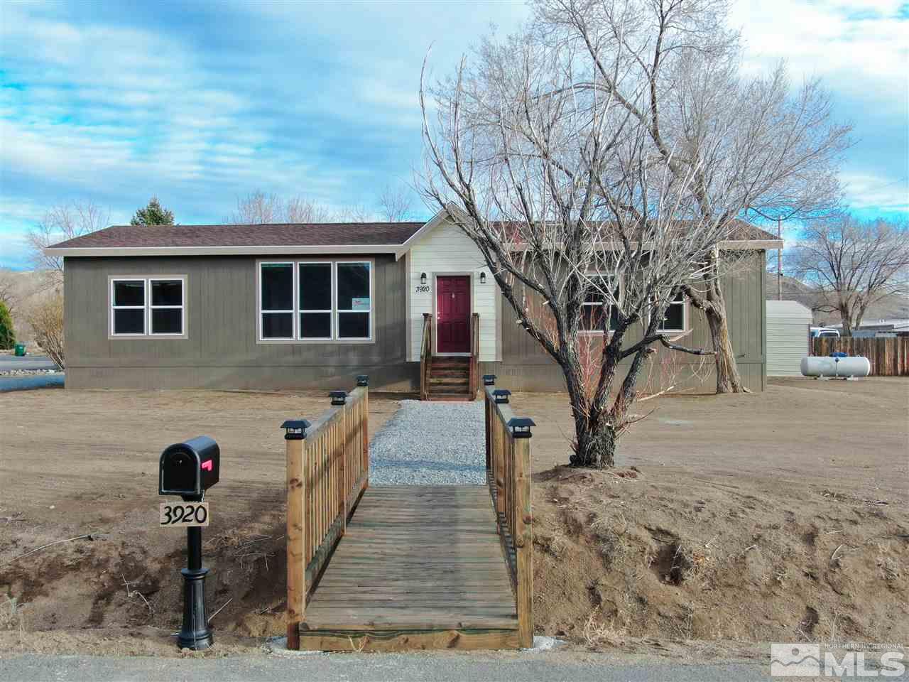 3920 Goldfinch Drive Reno, NV 89508 - Photo 1 of 16 a front view of a house with a yard