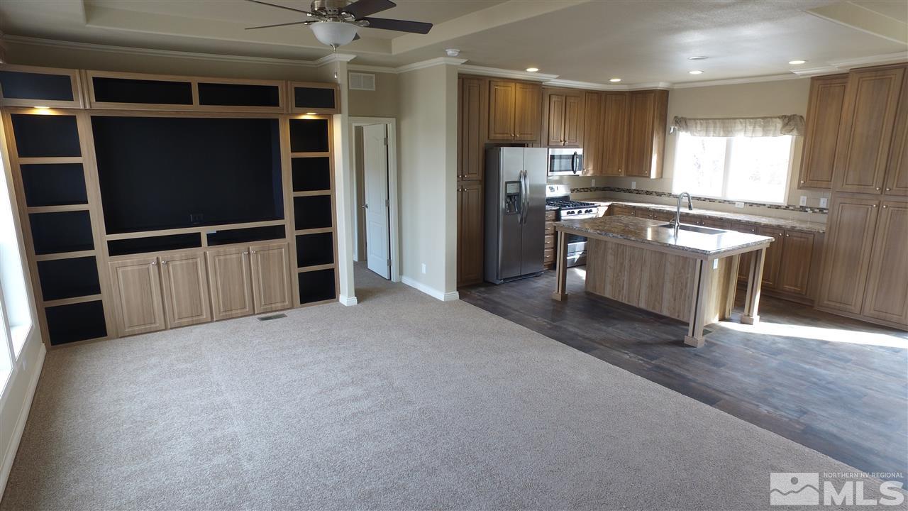 3920 Goldfinch Drive Reno, NV 89508 - Photo 11 of 16 a view of a kitchen with refrigerator and wooden floor