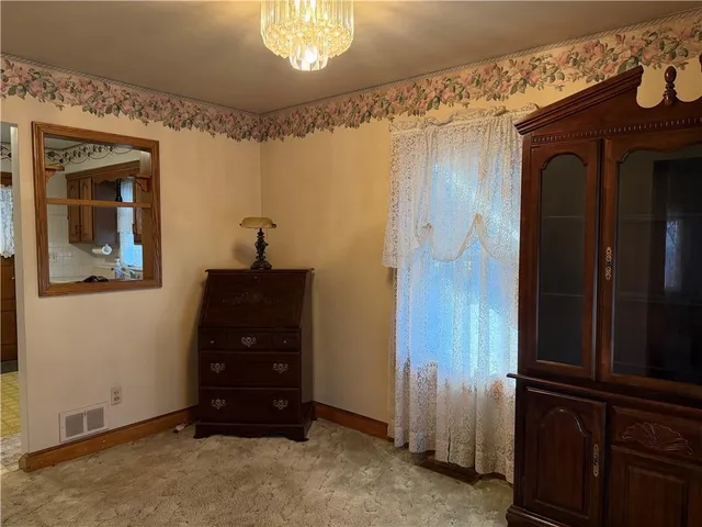 a room that has a dresser in it