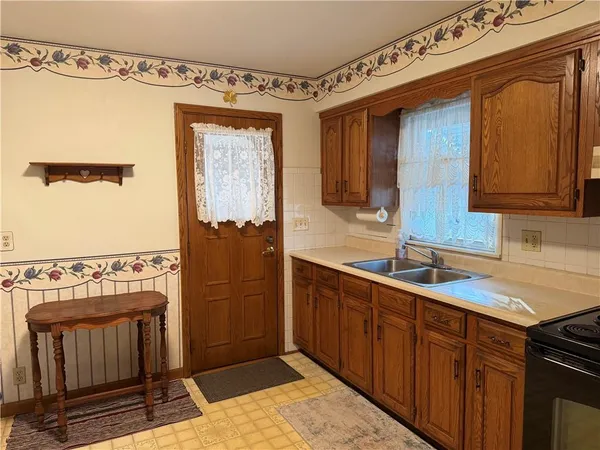a bathroom with a sink a mirror and shower
